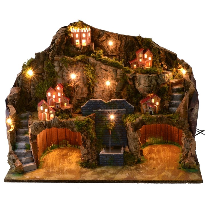 Illuminated nativity scene with working fountain and cave for statues