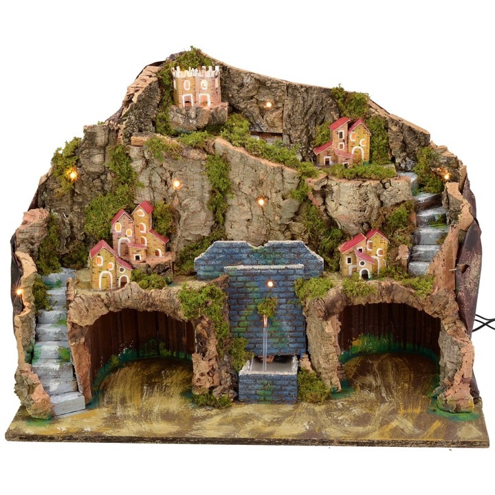 Illuminated nativity scene with working fountain and cave for statues