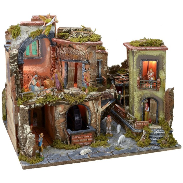 Complete nativity scene with statues, illuminated village, and oven