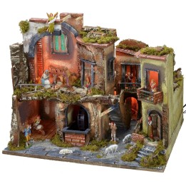 Complete nativity scene with statues, illuminated village, and oven