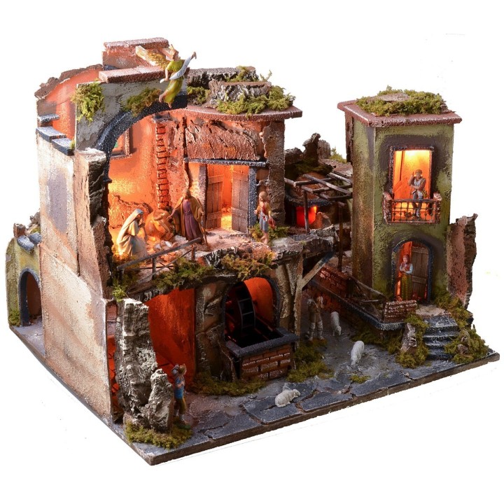 Complete nativity scene with statues, illuminated village, and oven
