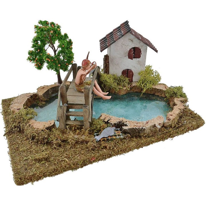 Estanque con efecto profundidad pescador Landi, árbol y casa