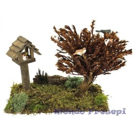 Pradera con casita y árbol con pájaros