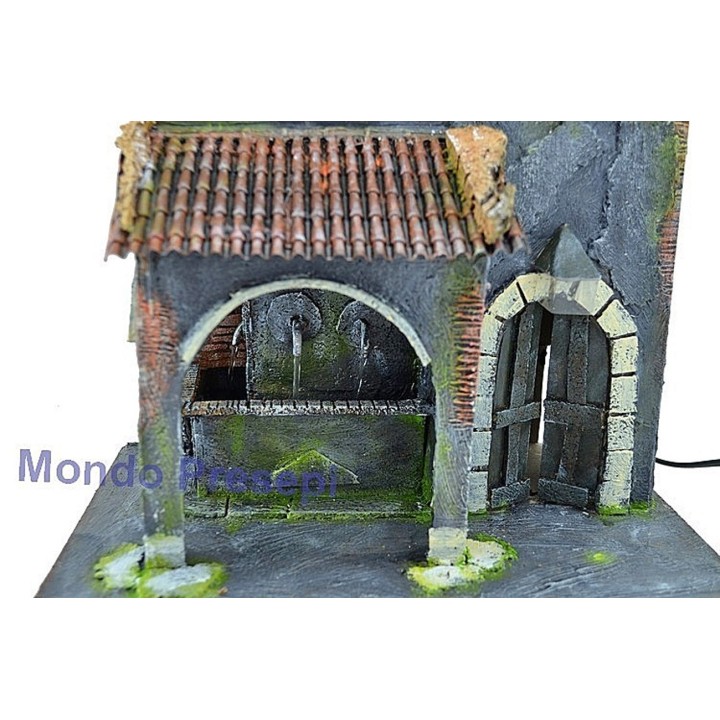 Casa con fontana a 3 uscite d'acqua e lampione