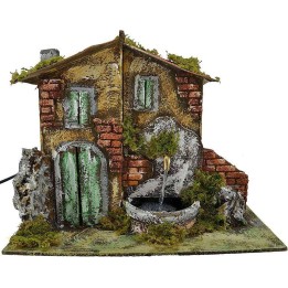Casa presepe con fontana cm 33x18x25 h.