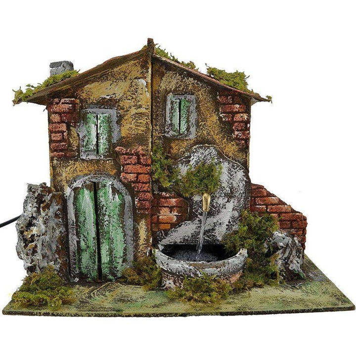 Casa presepe con fontana cm 33x18x25 h.