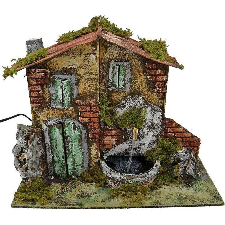 Casa presepe con fontana cm 33x18x25 h.