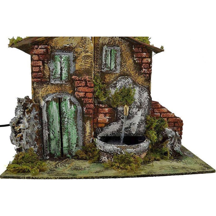Casa presepe con fontana cm 33x18x25 h.