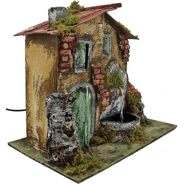 Casa presepe con fontana cm 33x18x25 h.