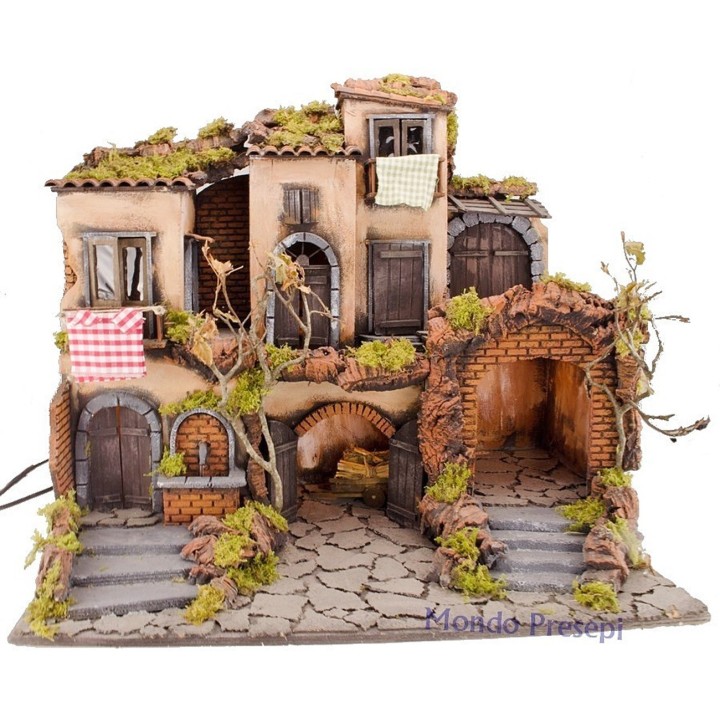 18th-century Neapolitan Nativity scene with illuminated village and fountain