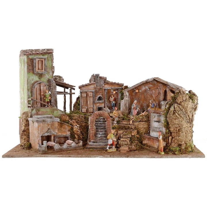 Illuminated nativity scene complete with Landi statues and landscape