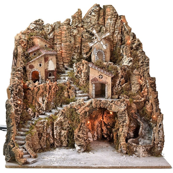 Illuminated nativity scene with windmill, waterfall, and oven