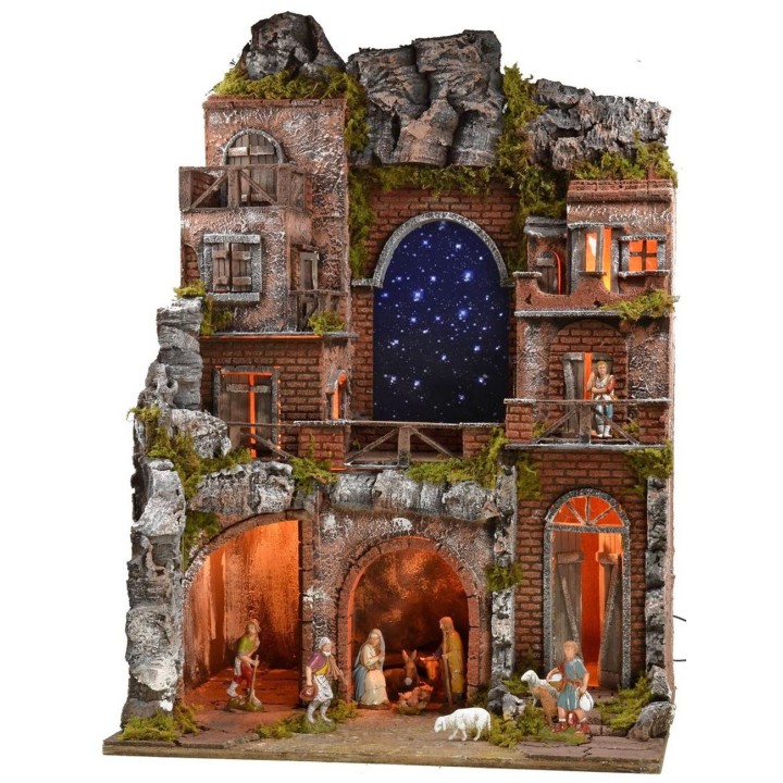 Illuminated nativity scene complete with Landi statues and starry sky