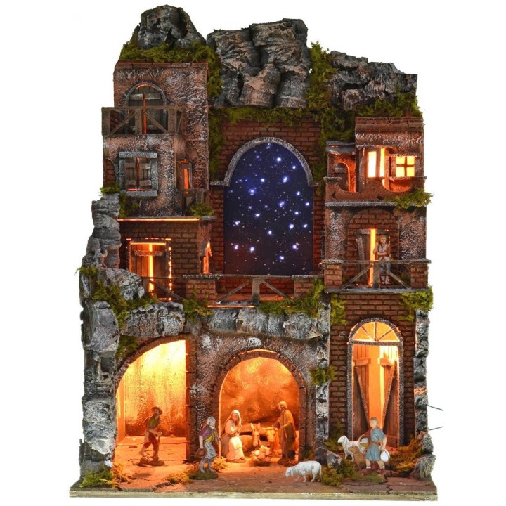 Illuminated nativity scene complete with Landi statues and starry sky