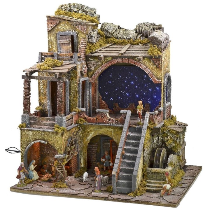 Illuminated nativity scene complete with Landi statues with starry sky