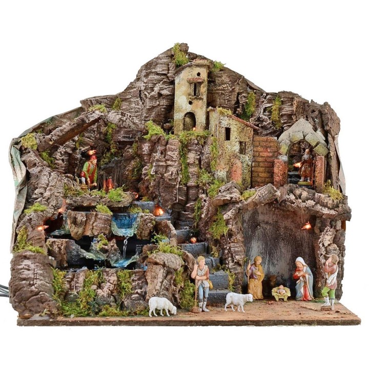 Illuminated nativity scene complete with Landi statues with fire and waterfall