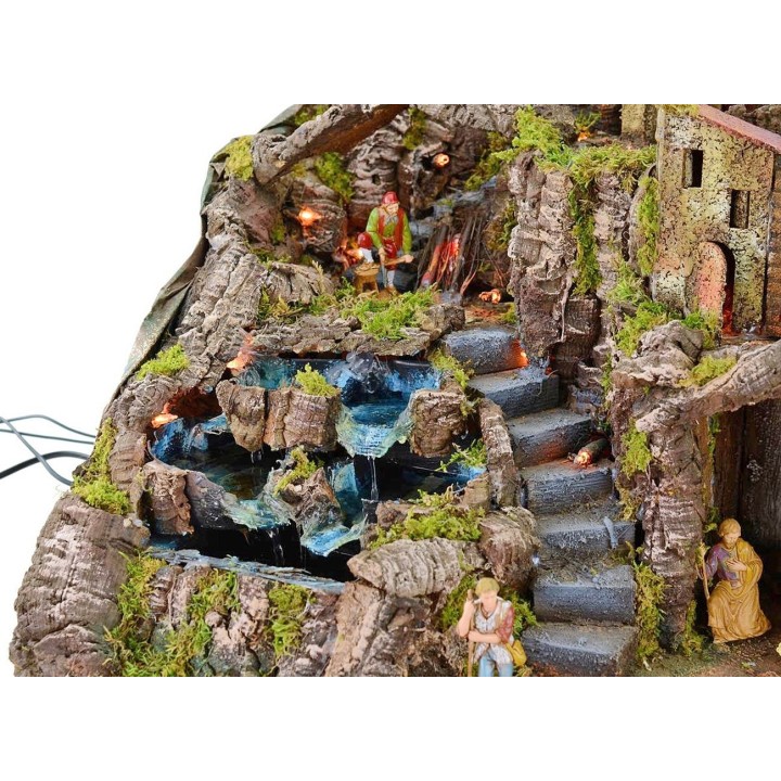 Illuminated nativity scene complete with Landi statues with fire and waterfall