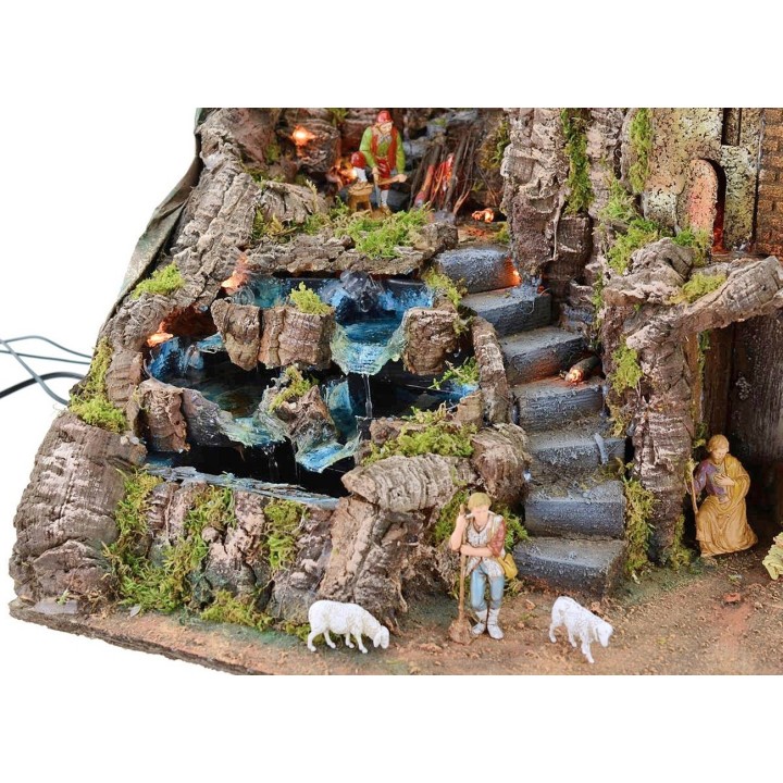 Illuminated nativity scene complete with Landi statues with fire and waterfall