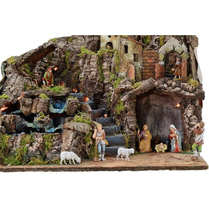 Illuminated nativity scene complete with Landi statues with fire and waterfall