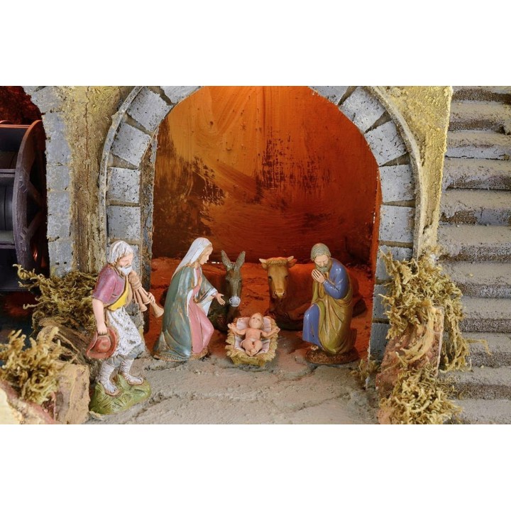 Illuminated nativity scene complete with Landi statues with water mill