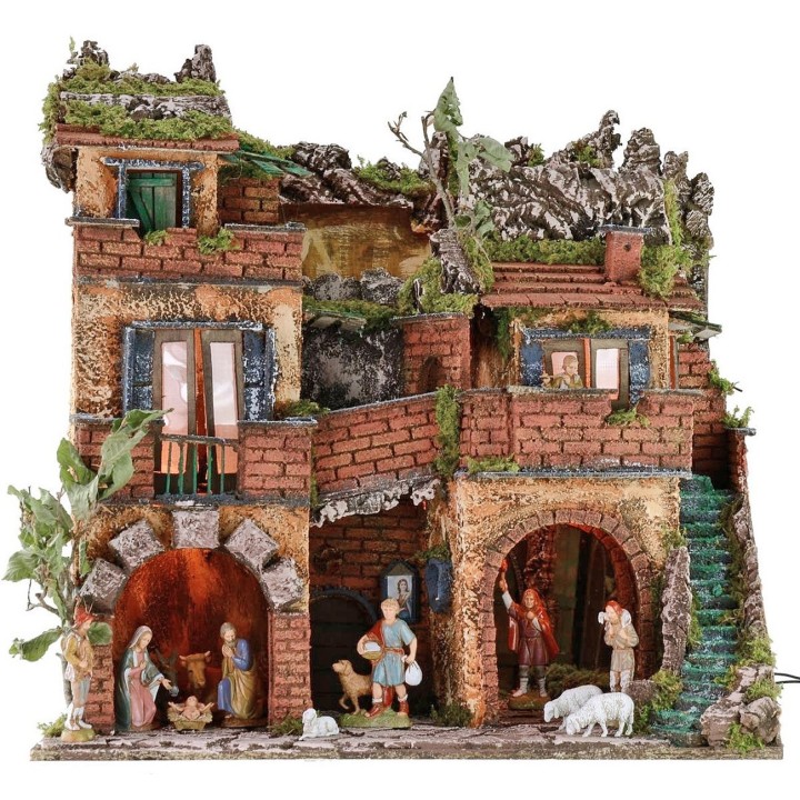Illuminated nativity scene complete with Landi statues with mirror