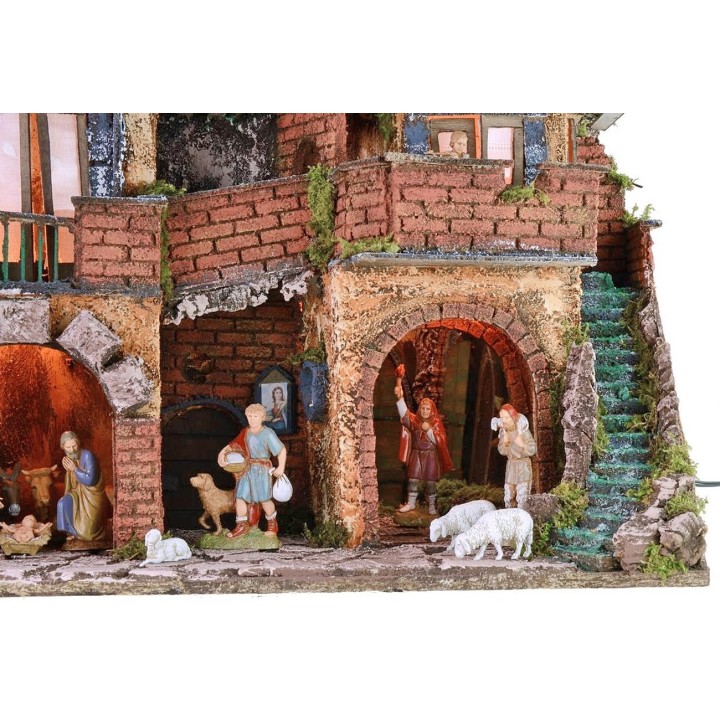 Illuminated nativity scene complete with Landi statues with mirror