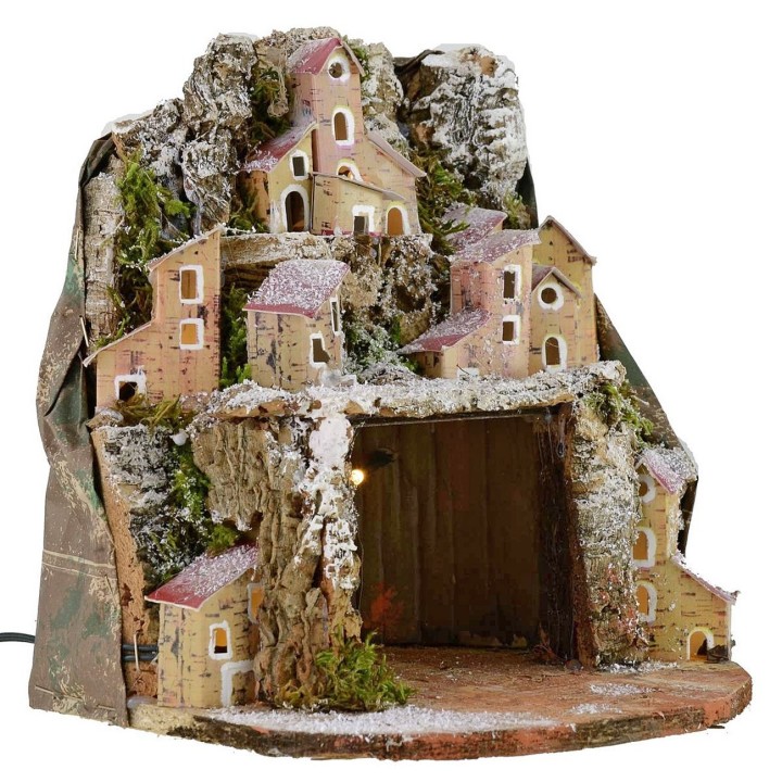 Snowy illuminated nativity scene with village and cave cm 20x20x24 h