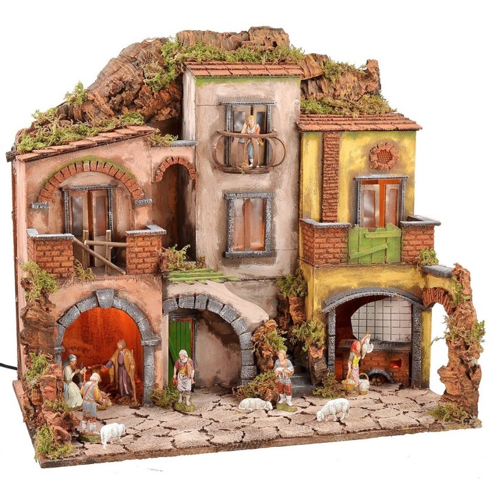 Illuminated Neapolitan nativity scene complete with Landi statues