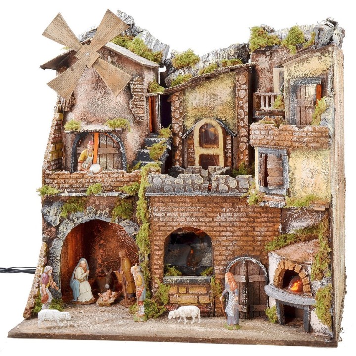 Illuminated Neapolitan nativity scene with oven, waterfall, and mill