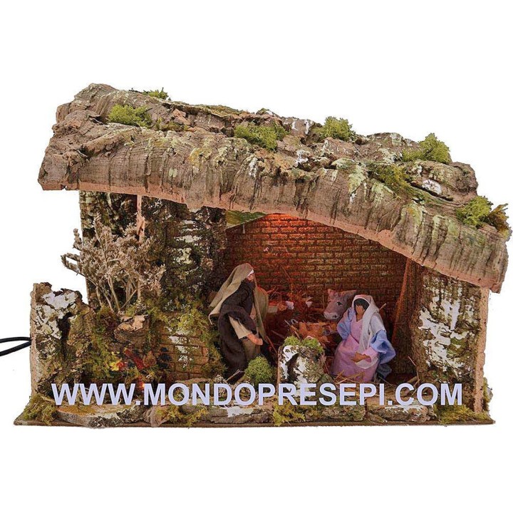 Cabaña del belén con natividad en movimiento