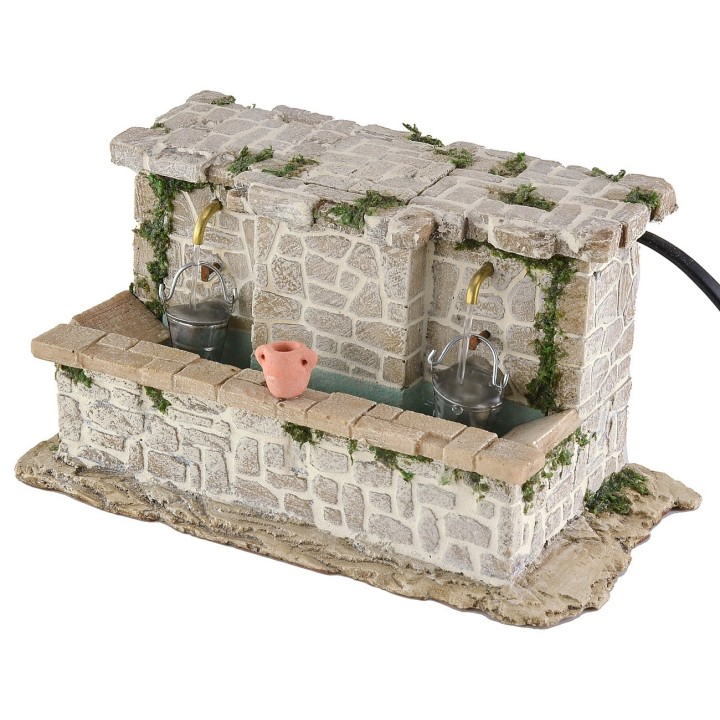 Lavadero de piedra con 2 grifos y cubos