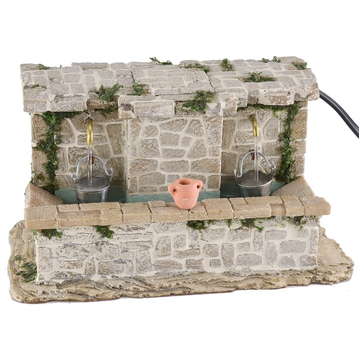 Lavadero de piedra con 2 grifos y cubos