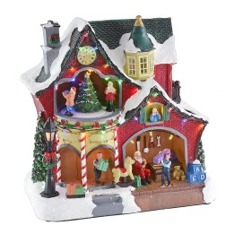 Christmas scenario with little house and carousel complete with
