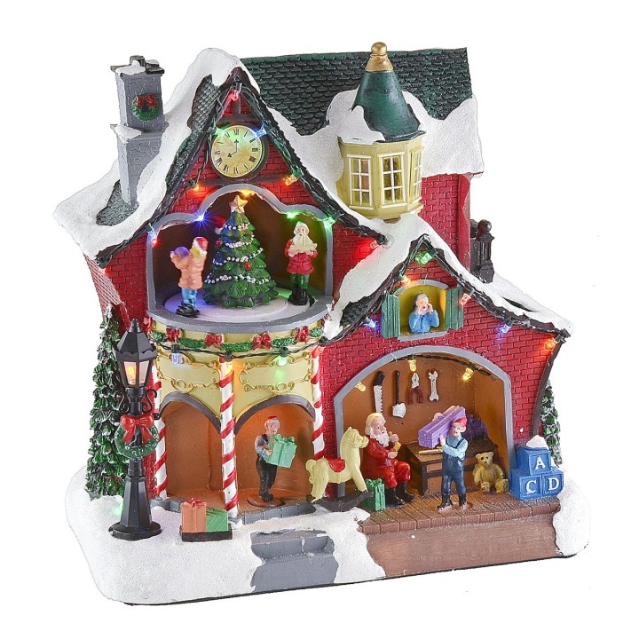 Christmas scenario with little house and carousel complete with