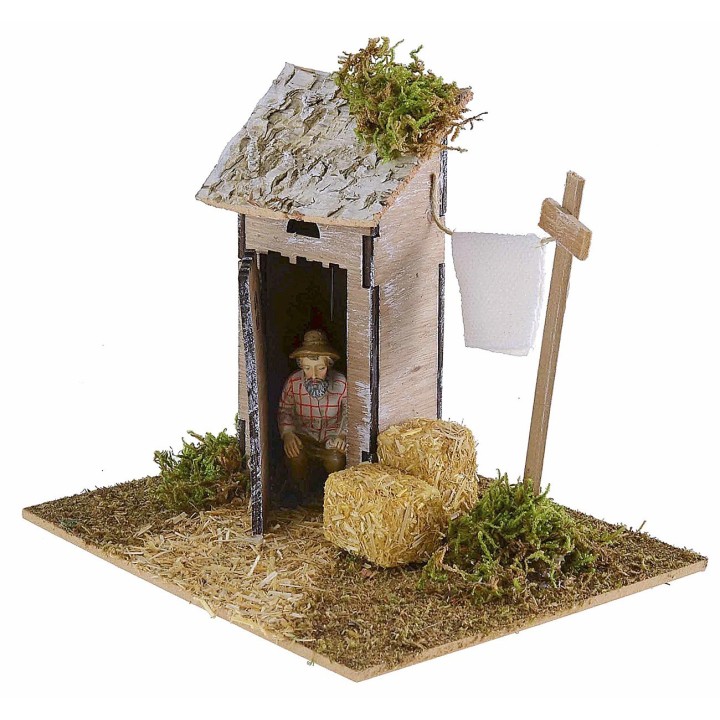 Setting with latrine and wooden drying rack for nativity scene