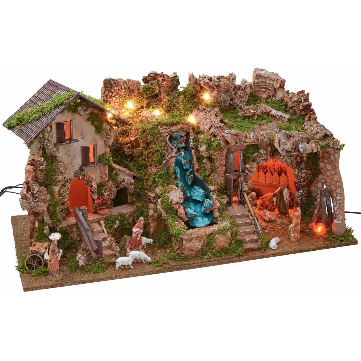 Illuminated nativity scene with grotto, waterfall, and complete fire