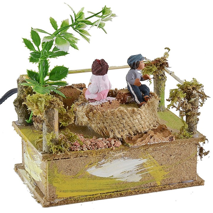Giostra con bambini cm 14x8,5 serie 10 cm in movimento