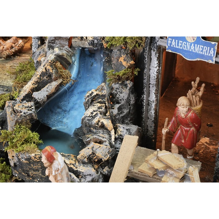 Illuminated nativity scene with working waterfall and fire effect