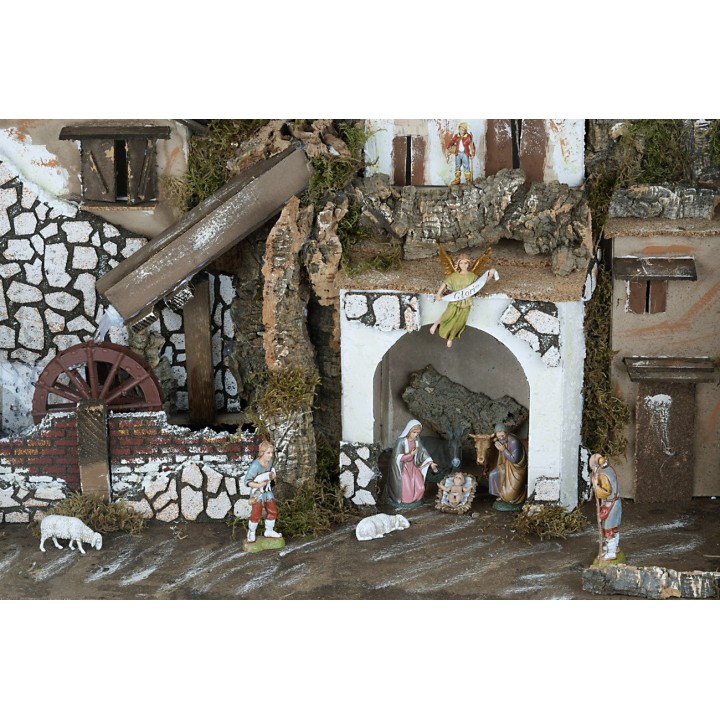 Presepe con statue illuminato con mulino completo di pompa a