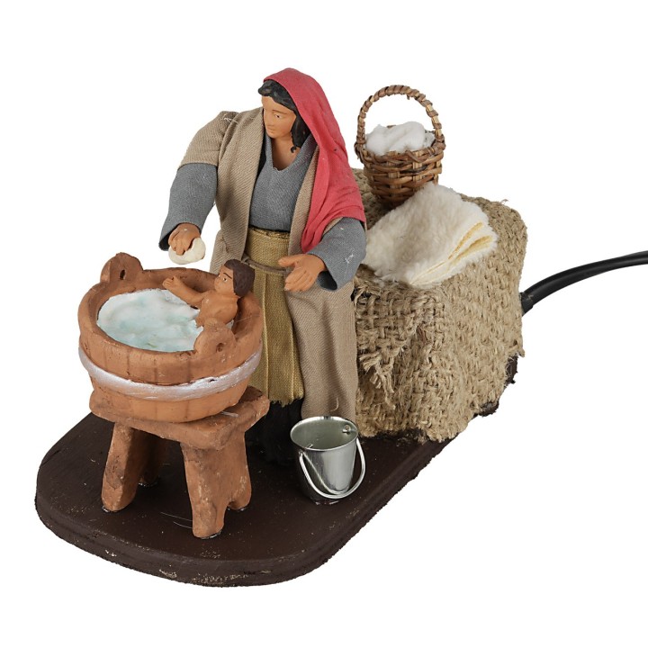 Woman washing baby 12 cm in motion