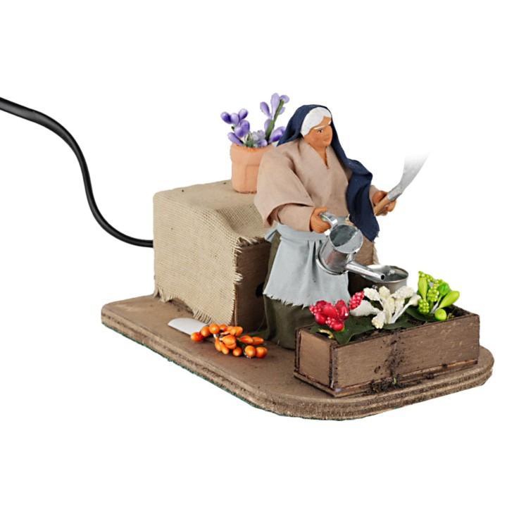 Donna che annaffia 10 cm in movimento