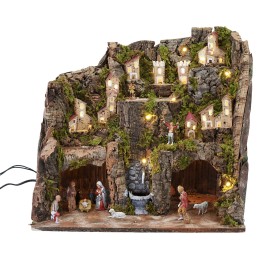 Pesebre completo con estatuas, luces y fuente en funcionamiento completo