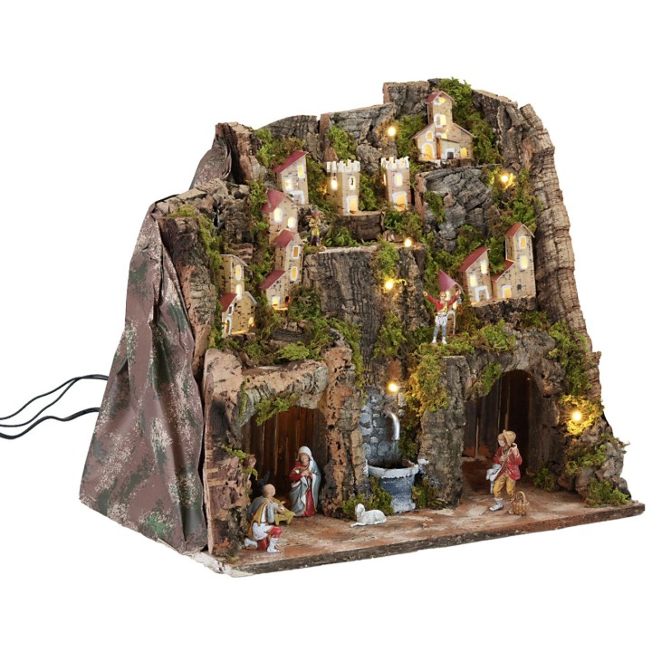 Pesebre completo con estatuas, luces y fuente en funcionamiento completo