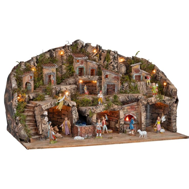 Illuminated nativity scene with caves, little houses, stream, and oven