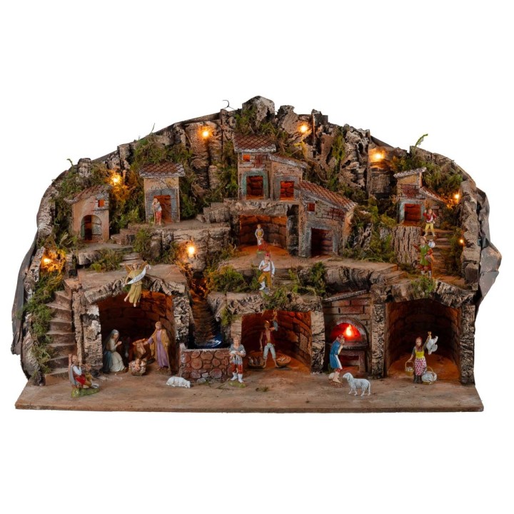 Presepe illuminato con grotte, casette, ruscello e forno
