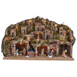 Pesebre iluminado con cuevas, casitas, arroyo y horno