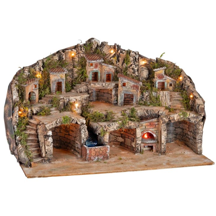 Presepe illuminato con grotte, casette, ruscello e forno