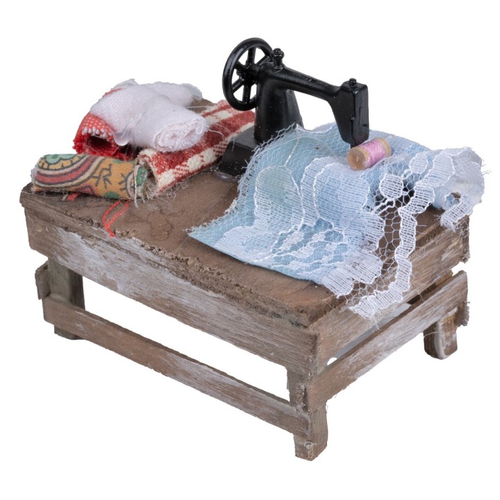 Seamstress table with machine and fabrics