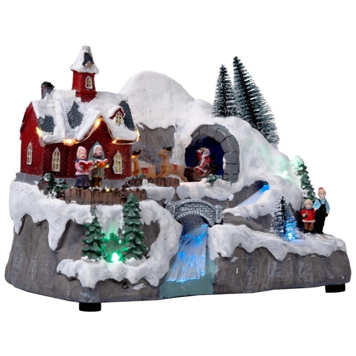 Christmas village with moving sleigh complete with lights and