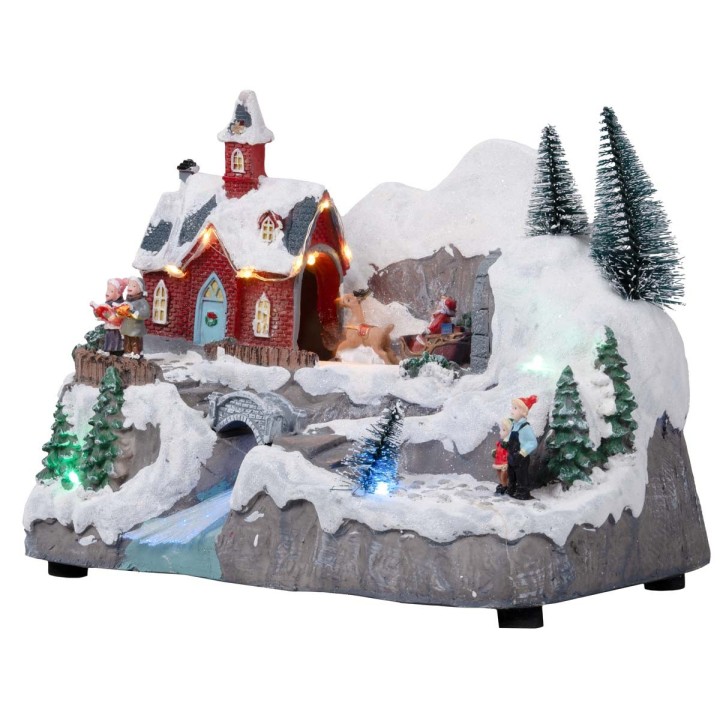 Christmas village with moving sleigh complete with lights and